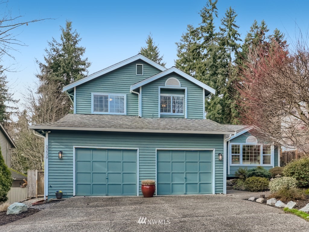 23630 3rd Place West Bothell, WA 98021 - Photo 1 of 28 a front view of a house with a yard and garage