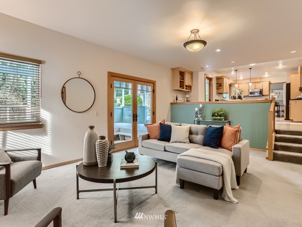 23630 3rd Place West Bothell, WA 98021 - Photo 15 of 28 a living room with furniture a rug and a large window