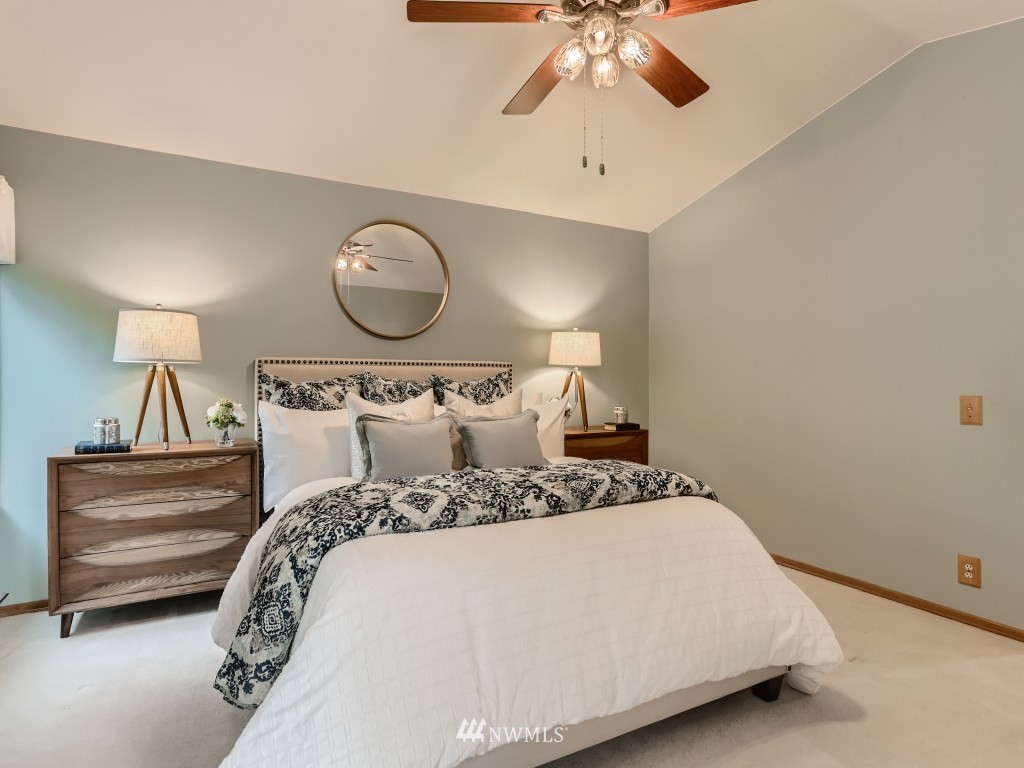 23630 3rd Place West Bothell, WA 98021 - Photo 18 of 28 a bedroom with a bed and a chandelier