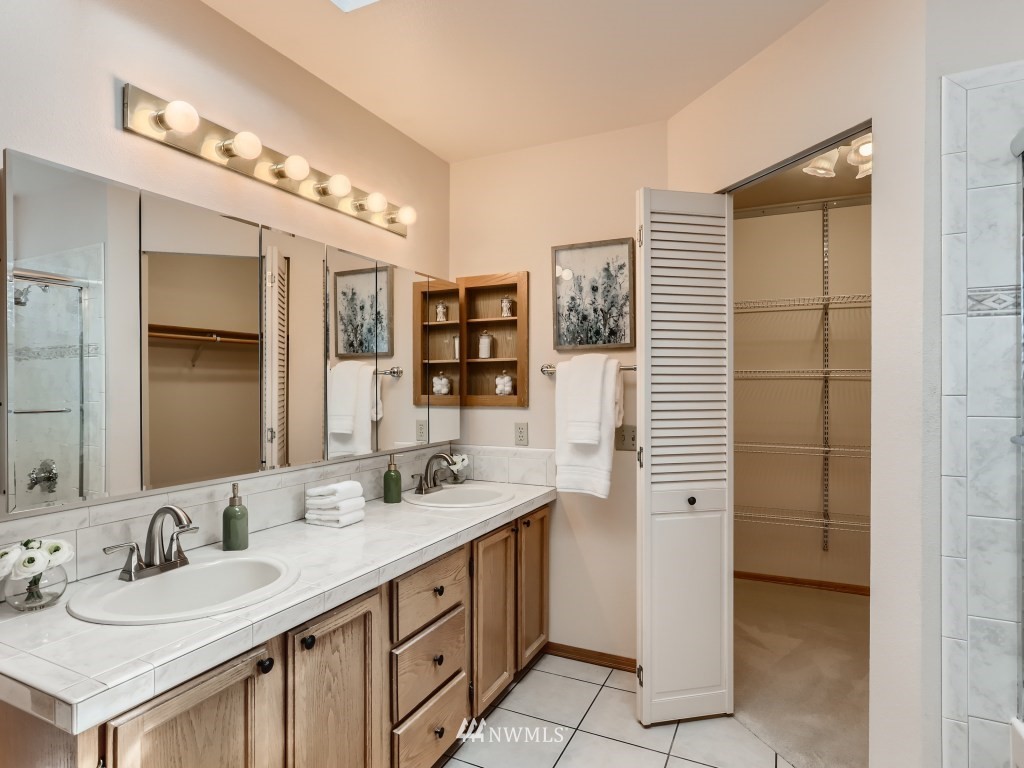 23630 3rd Place West Bothell, WA 98021 - Photo 19 of 28 a bathroom with a double vanity sink and a mirror