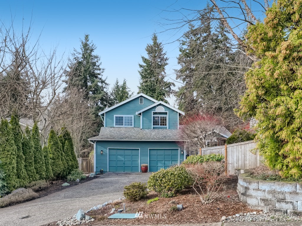 23630 3rd Place West Bothell, WA 98021 - Photo 2 of 28 a front view of a house with a garden