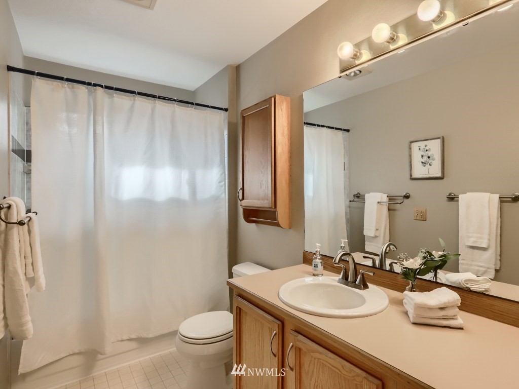 23630 3rd Place West Bothell, WA 98021 - Photo 23 of 28 a bathroom with a double vanity sink mirror and toilet
