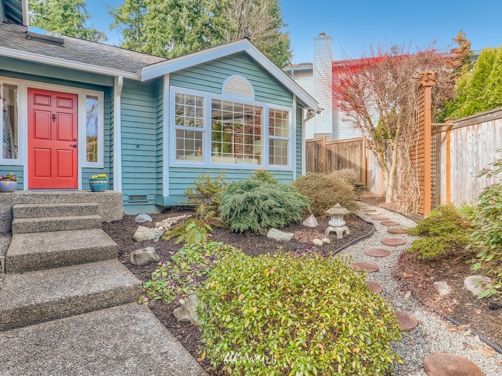 23630 3rd Place West Bothell, WA 98021 - Photo 3 of 28 a front view of a house with garden