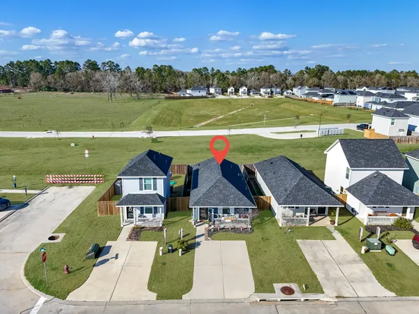 an aerial view of a house with a lake view