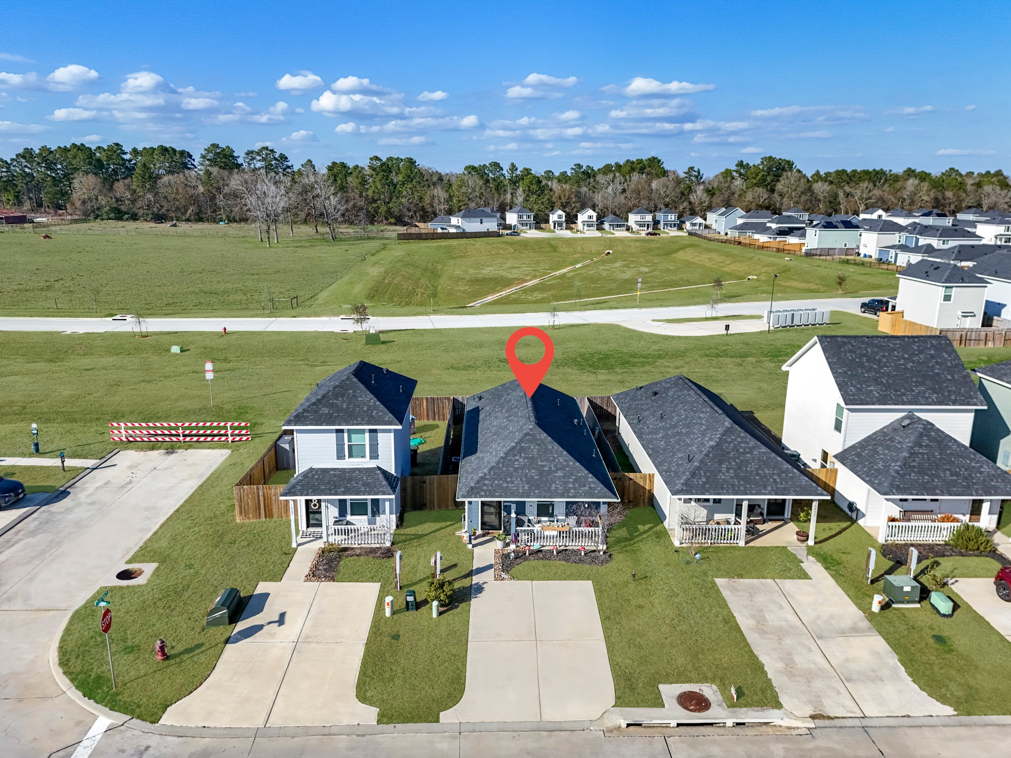 16511 Colleen Place Conroe, TX 77306 - Photo 1 of 17 an aerial view of a house with a lake view