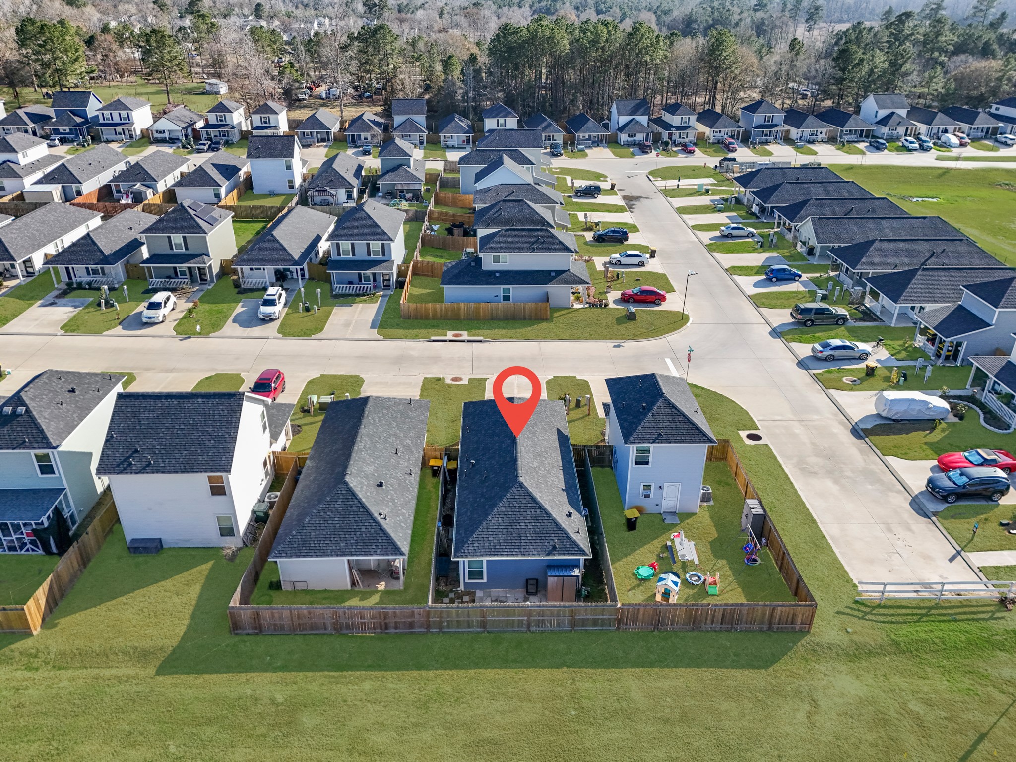 16511 Colleen Place Conroe, TX 77306 - Photo 4 of 17 an aerial view of residential houses with outdoor space and swimming pool