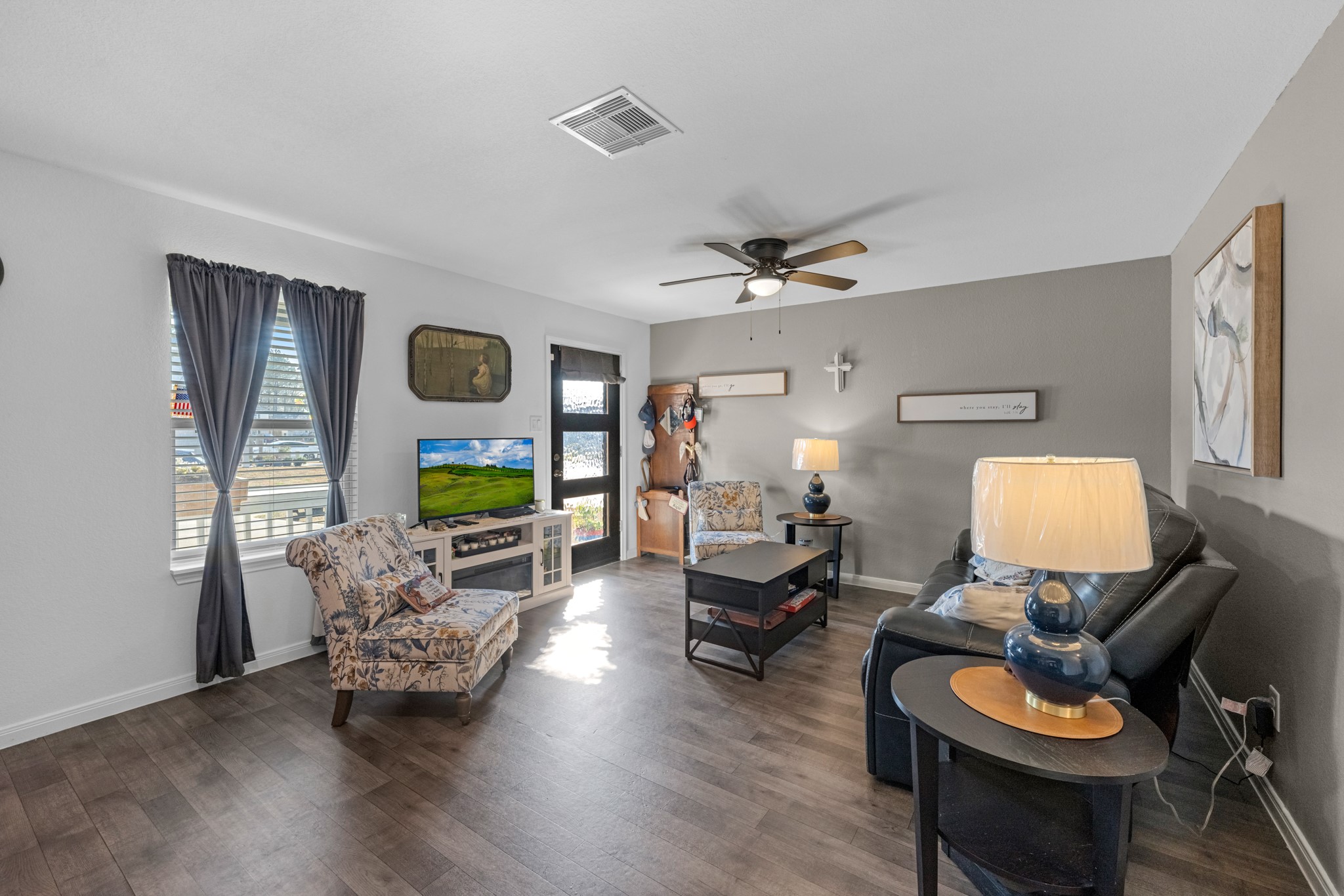 16511 Colleen Place Conroe, TX 77306 - Photo 5 of 17 a living room with furniture and wooden floor