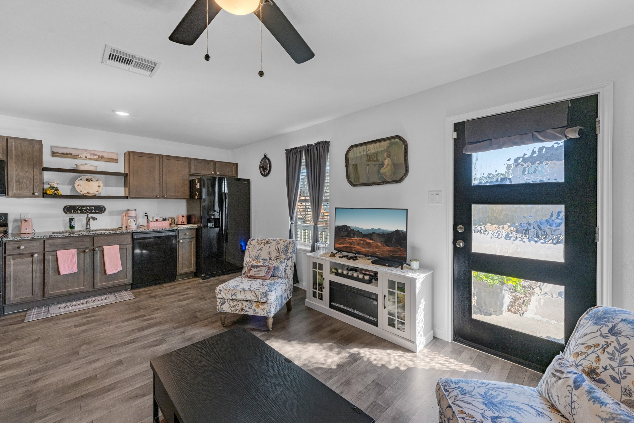 16511 Colleen Place Conroe, TX 77306 - Photo 6 of 17 a large kitchen with stainless steel appliances granite countertop a stove and a refrigerator