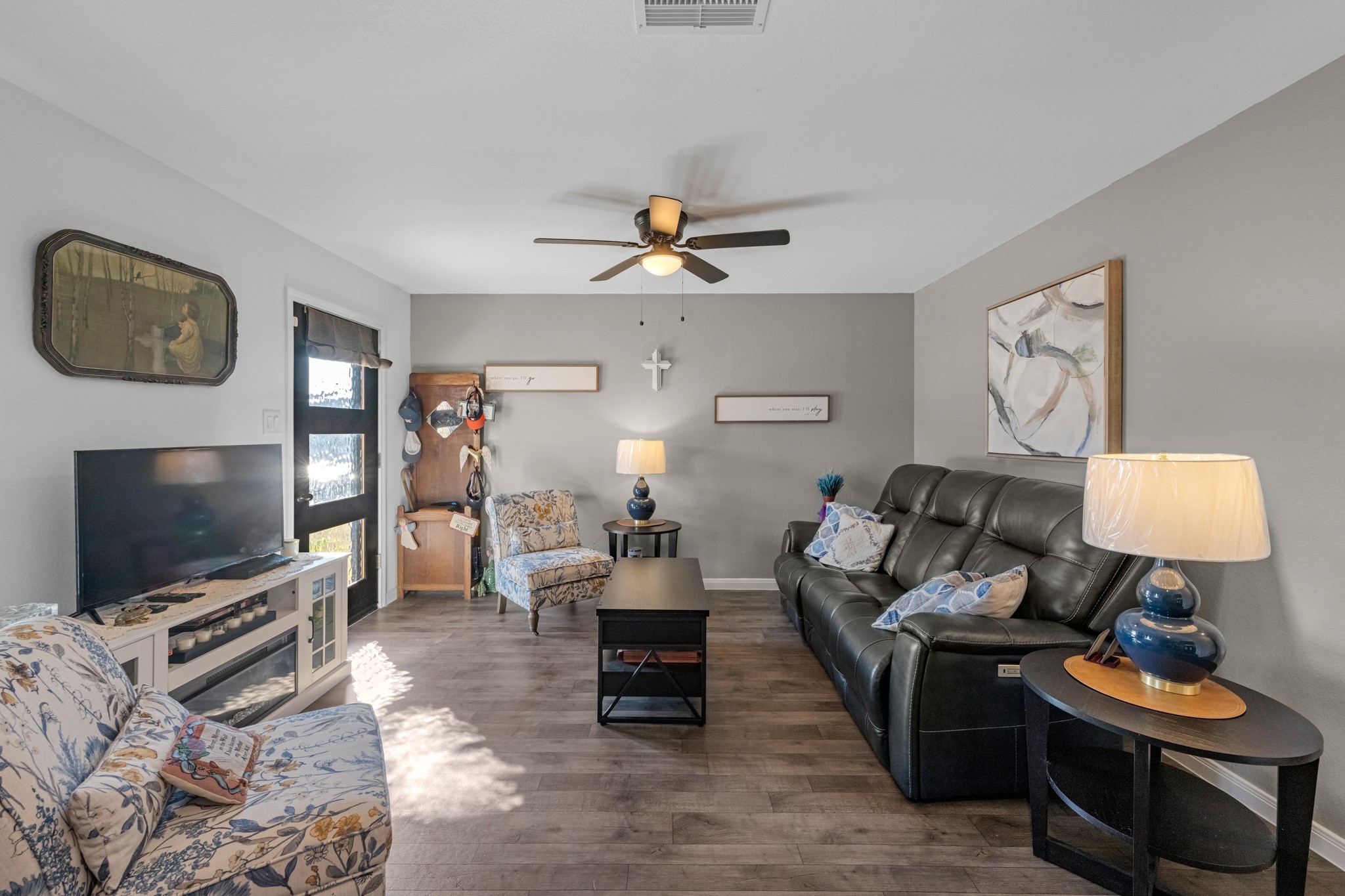 16511 Colleen Place Conroe, TX 77306 - Photo 7 of 17 a living room with furniture and a flat screen tv