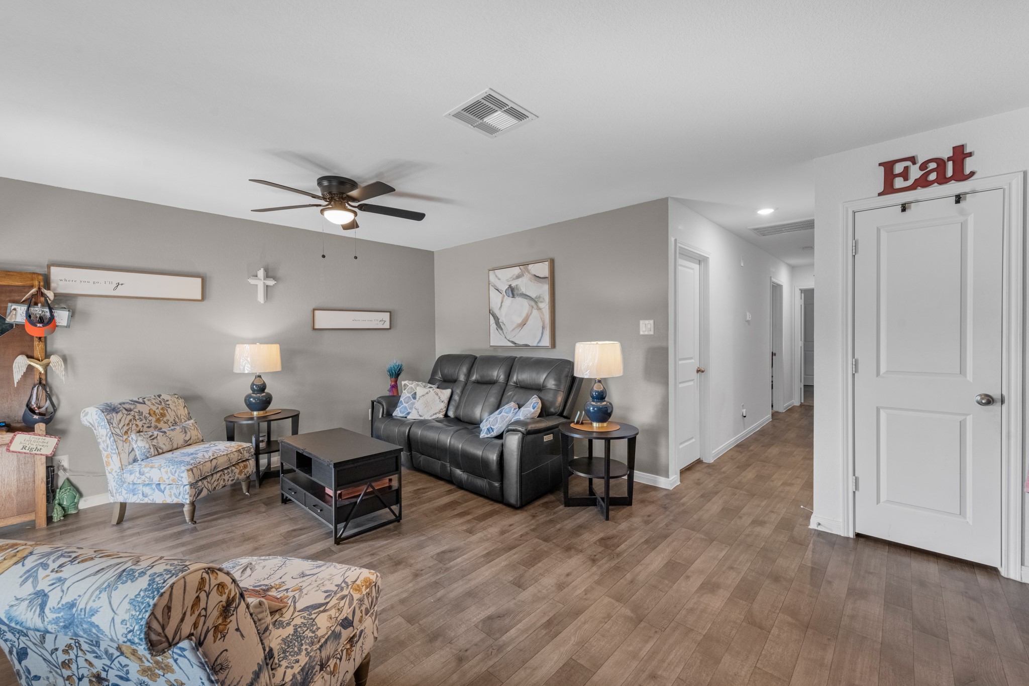 16511 Colleen Place Conroe, TX 77306 - Photo 9 of 17 a living room with furniture and a chandelier