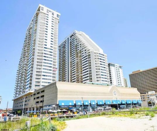 a view of a large building with swimming pool