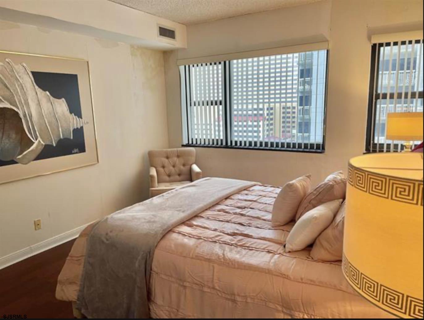 3101 Boardwalk, Unit 12102 Atlantic City, NJ 08401 - Photo 11 of 27 a bedroom with a bed and window