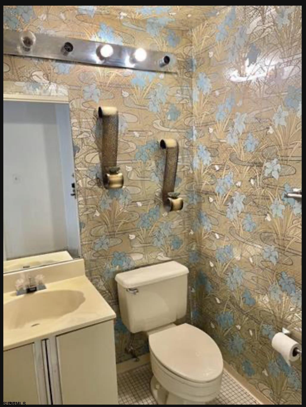 3101 Boardwalk, Unit 12102 Atlantic City, NJ 08401 - Photo 17 of 27 a white toilet sitting next to a bathroom sink