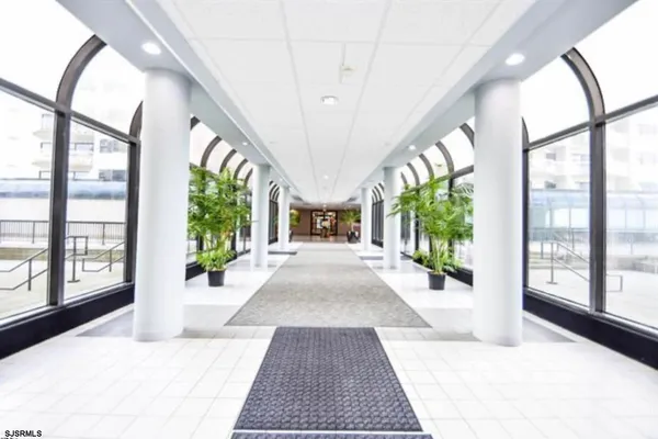 a view of an entryway with wooden floor and door