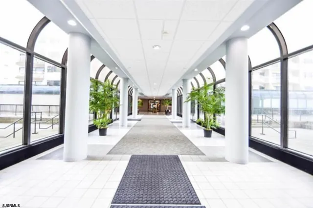 a view of an entryway with wooden floor and door