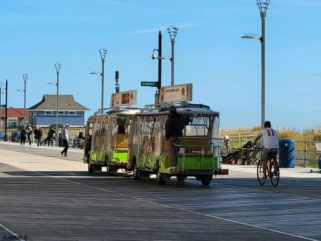 a view of a street with cars