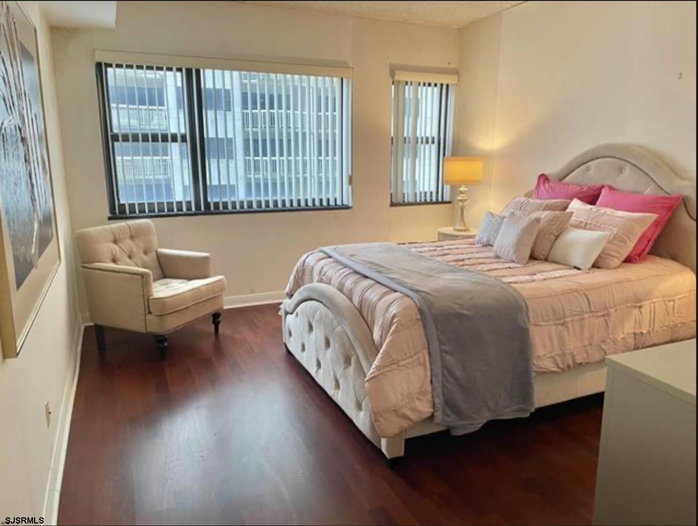 3101 Boardwalk, Unit 12102 Atlantic City, NJ 08401 - Photo 10 of 27 a bedroom with a bed and a couch