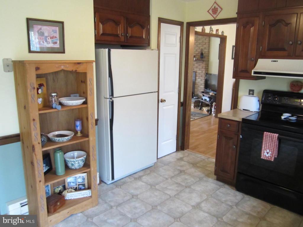 238 Hickory Drive Lititz, PA 17543 - Photo 11 of 27 a kitchen with a refrigerator and a stove