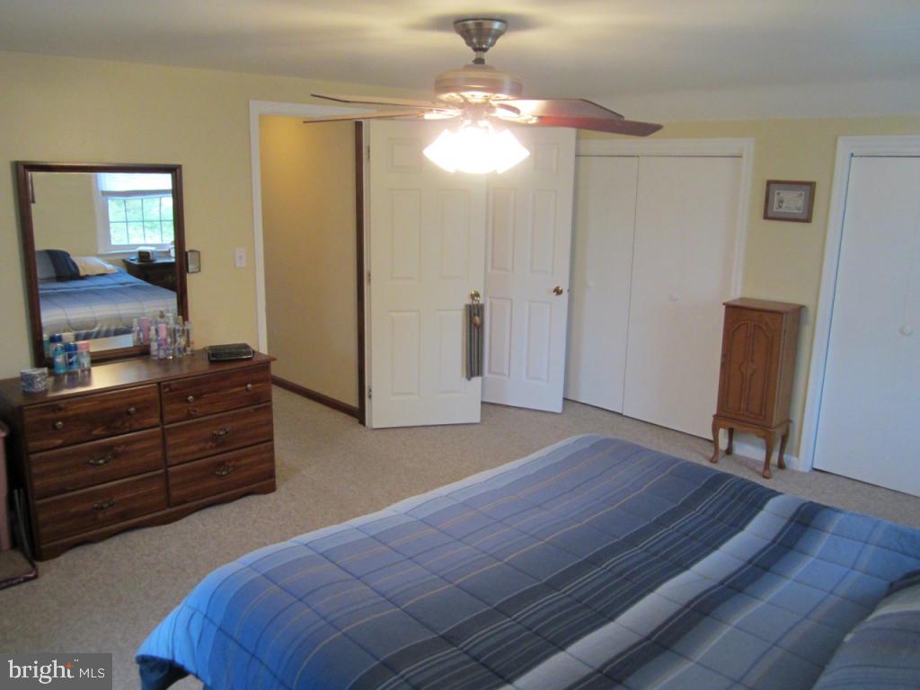 238 Hickory Drive Lititz, PA 17543 - Photo 15 of 27 a bedroom with a bed and wooden floor
