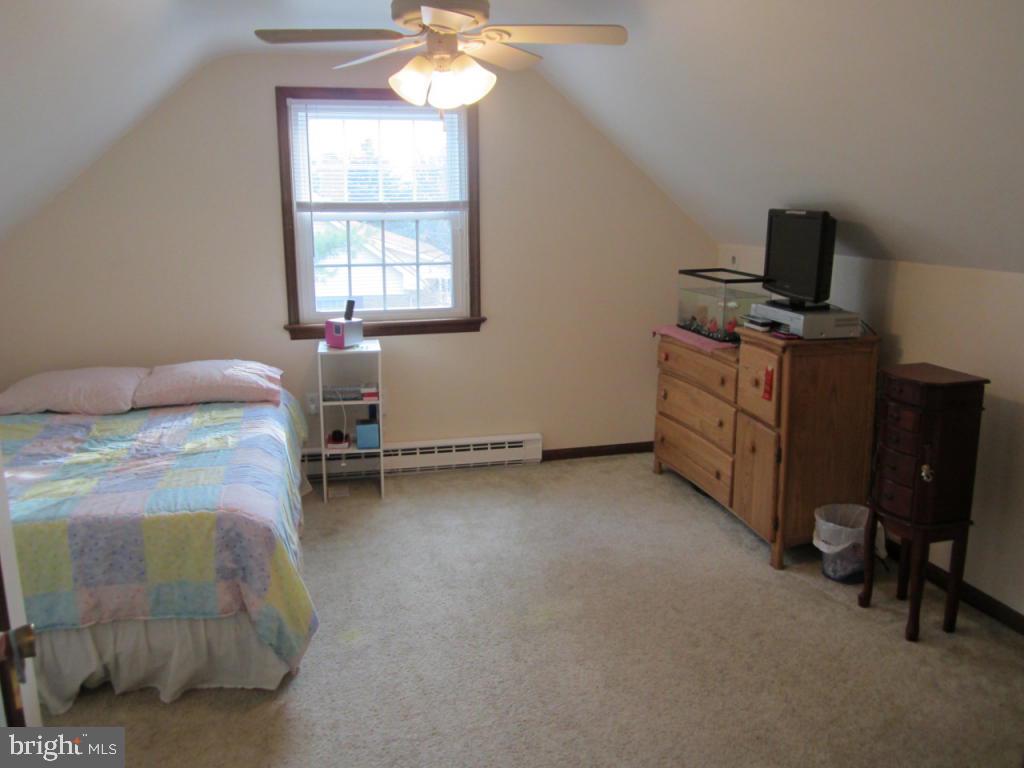 238 Hickory Drive Lititz, PA 17543 - Photo 19 of 27 a bedroom with a bed and a chandelier