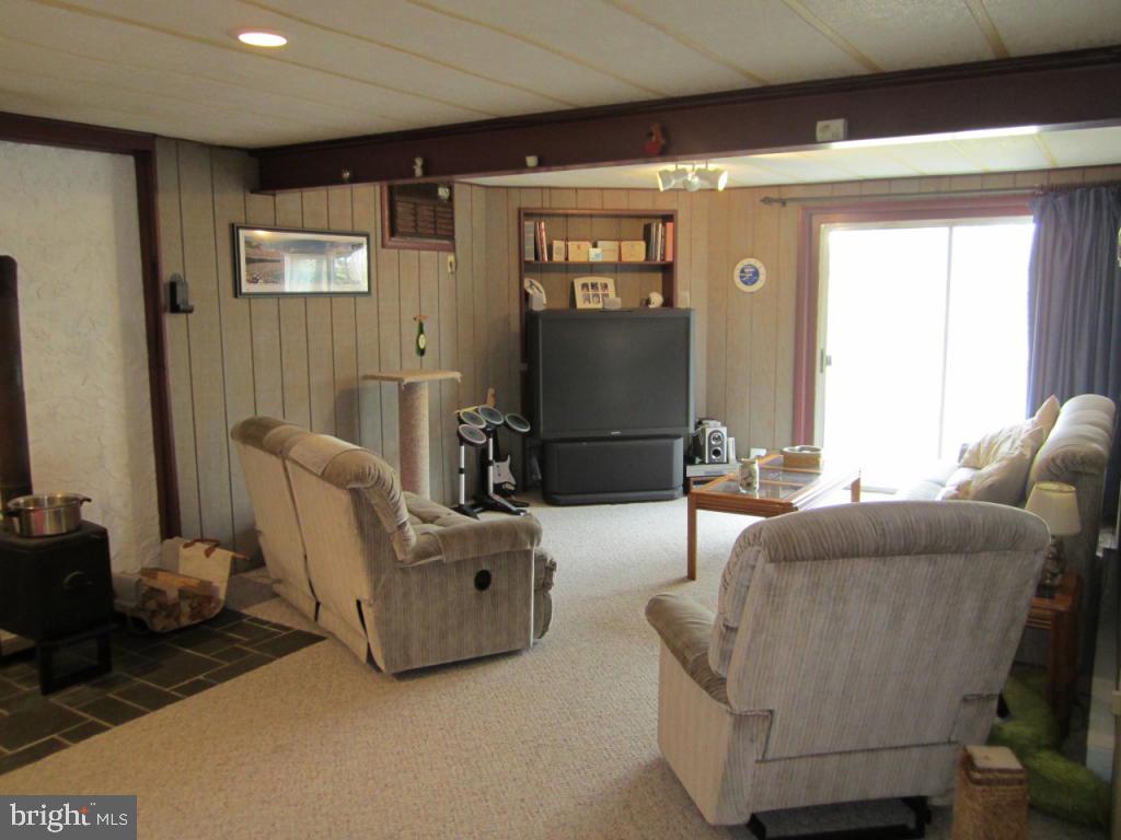 238 Hickory Drive Lititz, PA 17543 - Photo 24 of 27 a living room with furniture and a flat screen tv