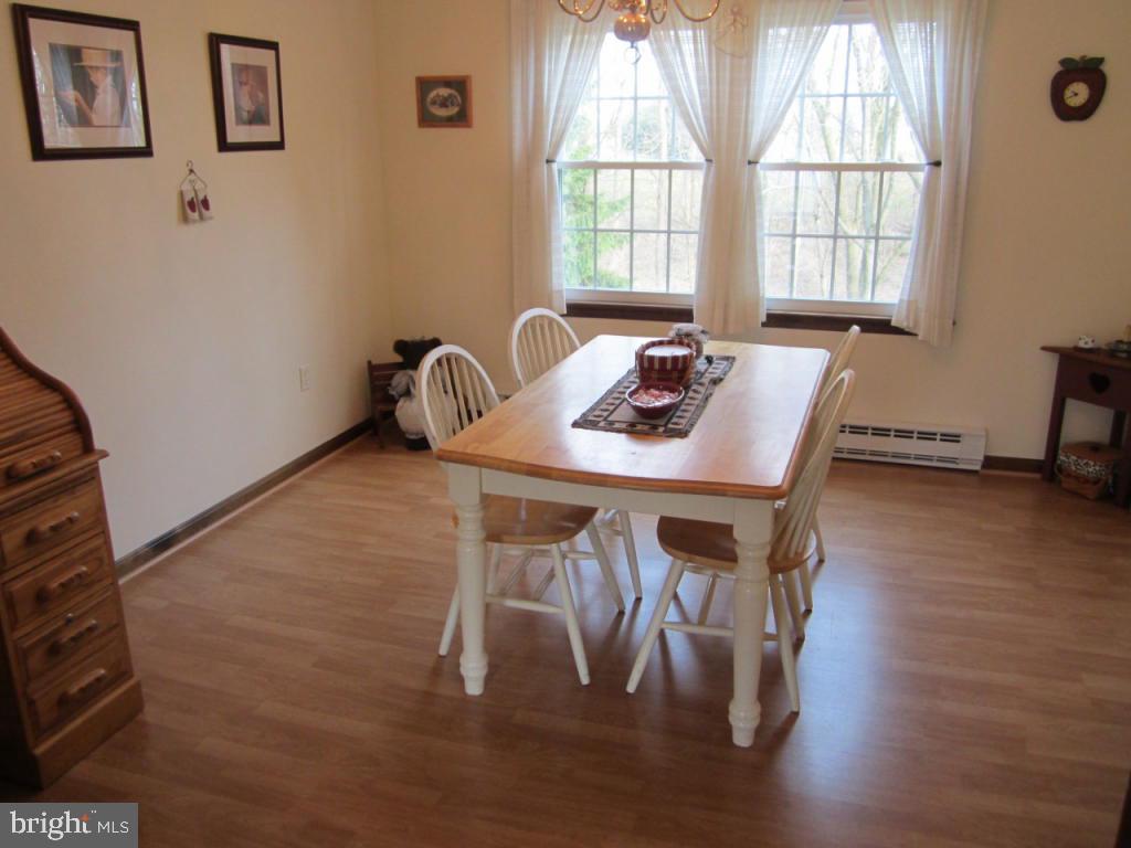238 Hickory Drive Lititz, PA 17543 - Photo 8 of 27 a view of a dining room with furniture window and wooden floor