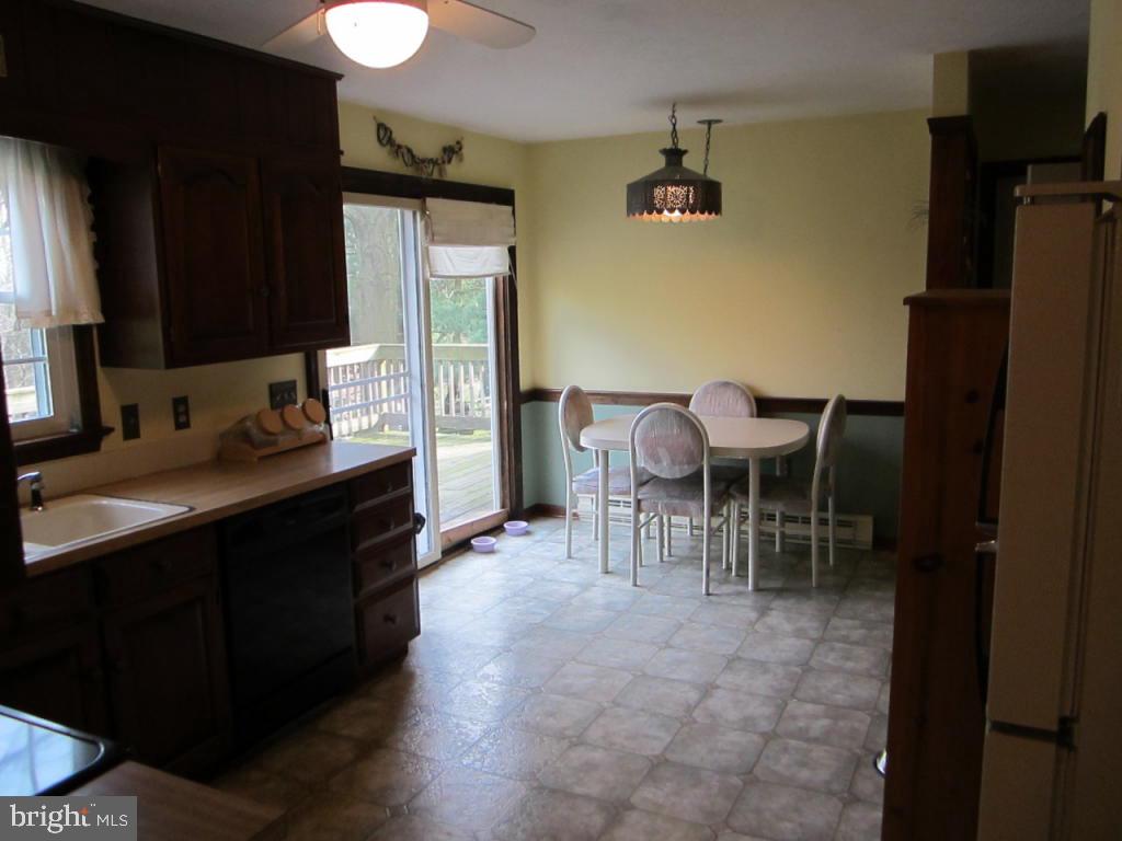238 Hickory Drive Lititz, PA 17543 - Photo 9 of 27 a kitchen with a table chairs sink and cabinets