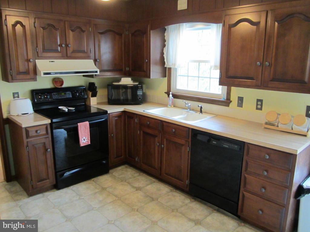 238 Hickory Drive Lititz, PA 17543 - Photo 10 of 27 a kitchen with stainless steel appliances granite countertop a sink stove and cabinets