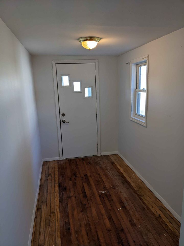 605 South Sycamore Street Villa Grove, IL 61956 - Photo 5 of 12 a view of an empty room and window
