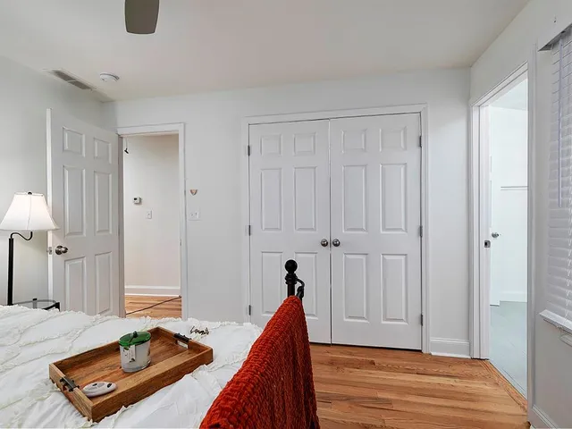 a bed room with a bed and a view of en suite bathroom