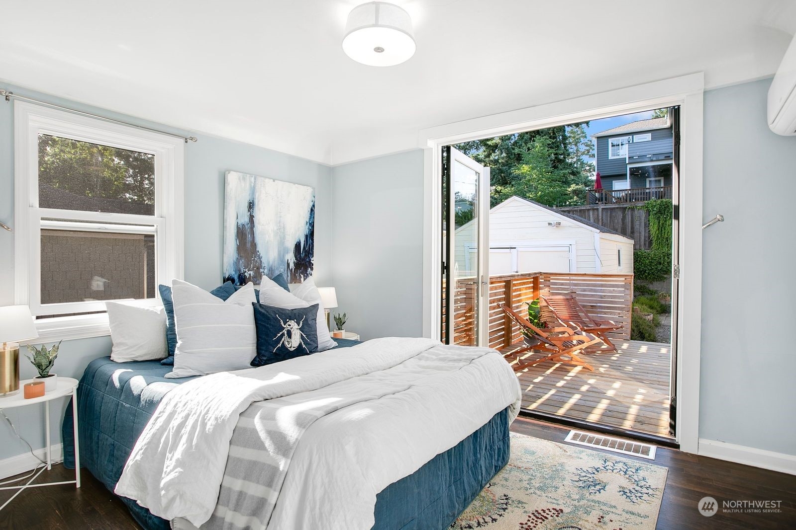 3702 Southwest Holden Street Seattle, WA 98126 - Photo 11 of 23 a bedroom with a bed and wooden floor