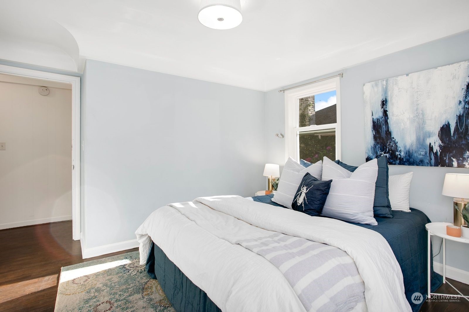 3702 Southwest Holden Street Seattle, WA 98126 - Photo 12 of 23 a bedroom with a bed and a window