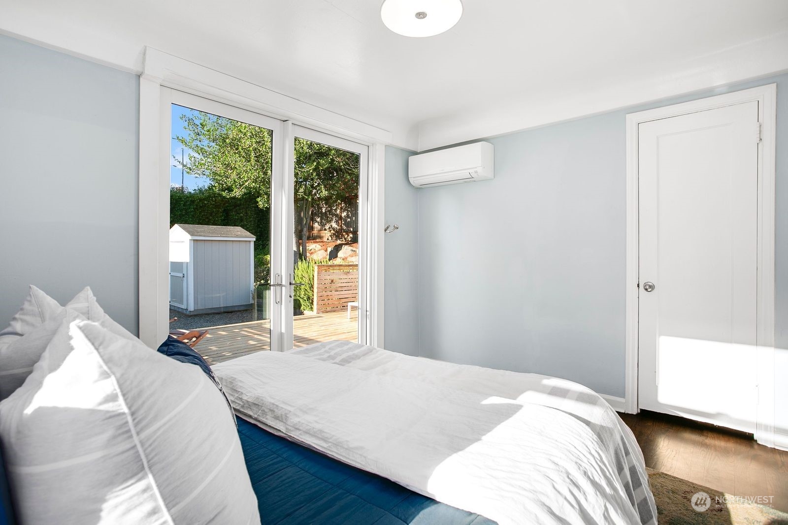 3702 Southwest Holden Street Seattle, WA 98126 - Photo 13 of 23 a bedroom with a bed and a window