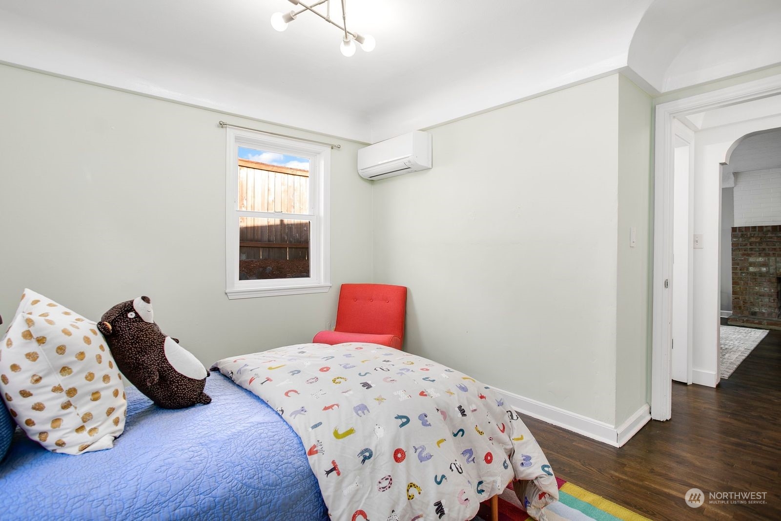 3702 Southwest Holden Street Seattle, WA 98126 - Photo 16 of 23 a bedroom with a bed and wooden floor