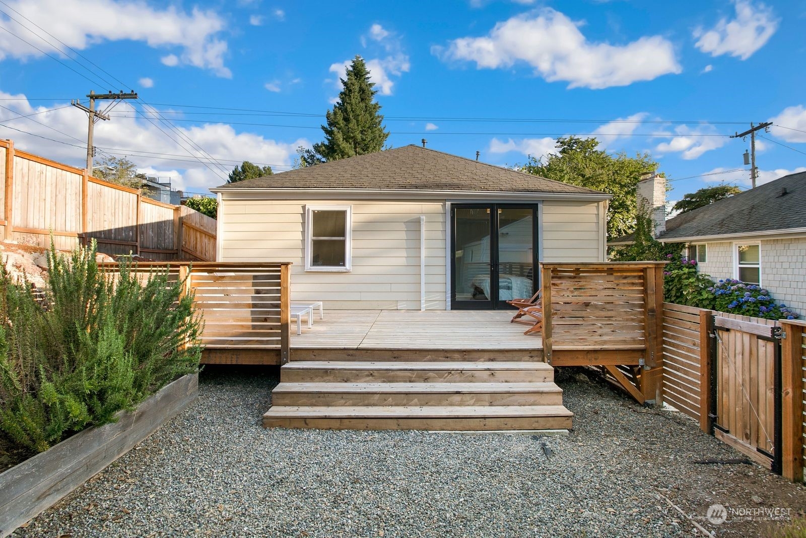 3702 Southwest Holden Street Seattle, WA 98126 - Photo 18 of 23 a view of a house with a yard