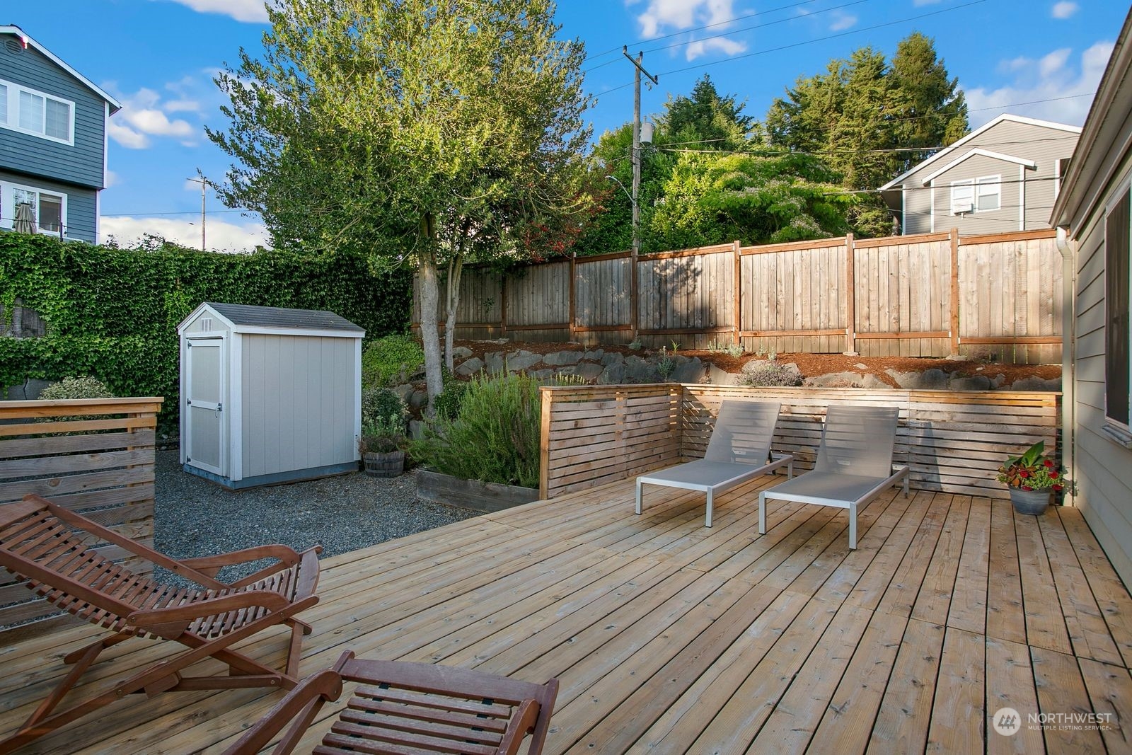 3702 Southwest Holden Street Seattle, WA 98126 - Photo 20 of 23 a view of a patio with table and chairs and wooden floor