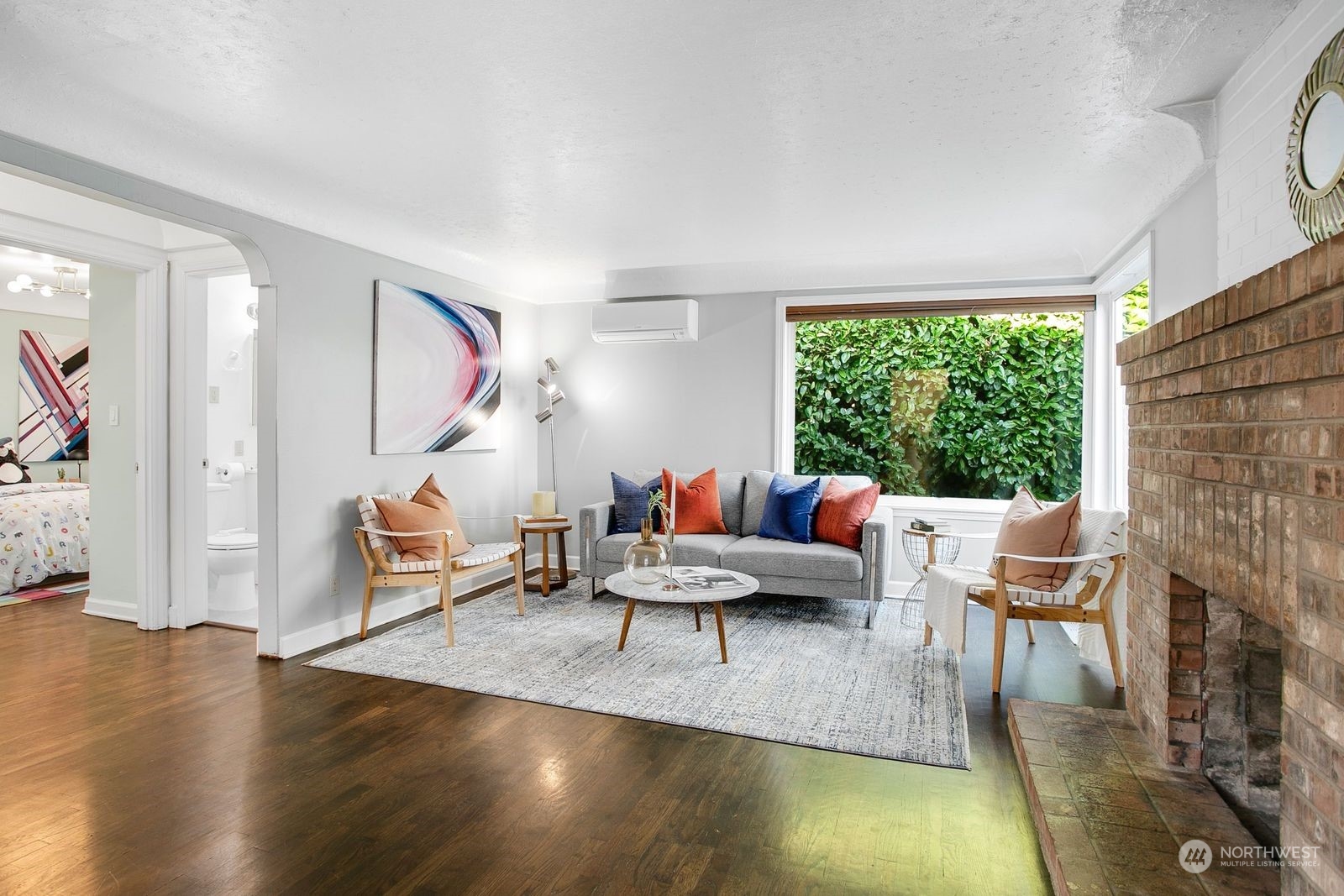 3702 Southwest Holden Street Seattle, WA 98126 - Photo 2 of 23 a living room with furniture and a wooden floor