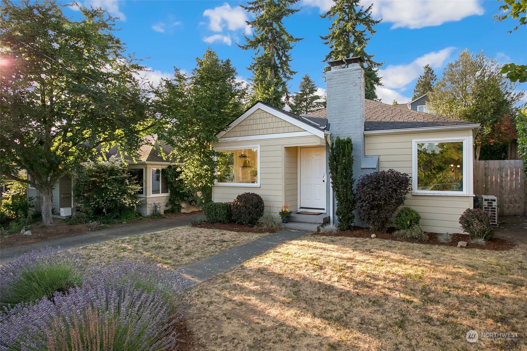 3702 Southwest Holden Street Seattle, WA 98126 - Photo 22 of 23 a white house that has a tree in front of it