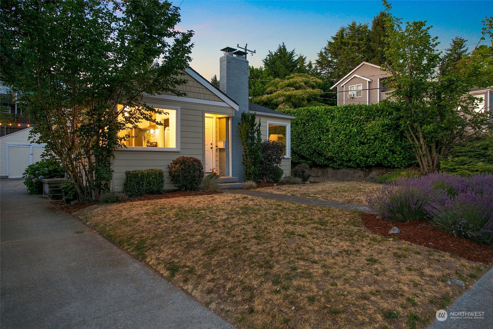 3702 Southwest Holden Street Seattle, WA 98126 - Photo 23 of 23 a front view of a house with garden