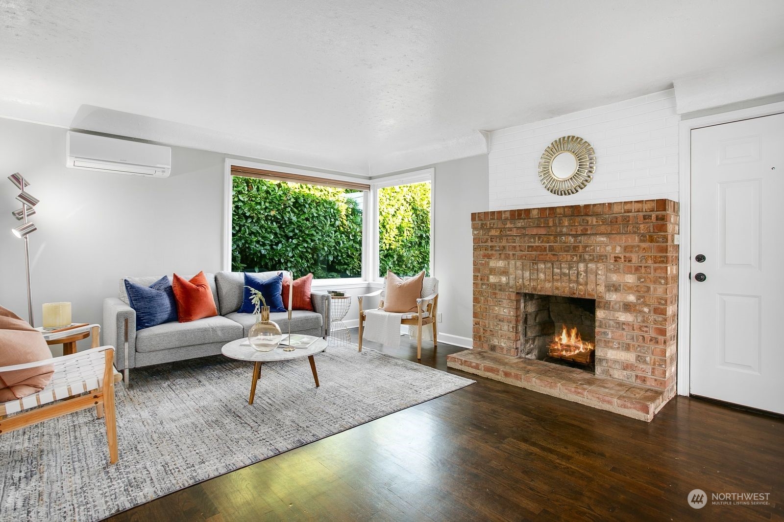 3702 Southwest Holden Street Seattle, WA 98126 - Photo 3 of 23 a living room with furniture and a fireplace