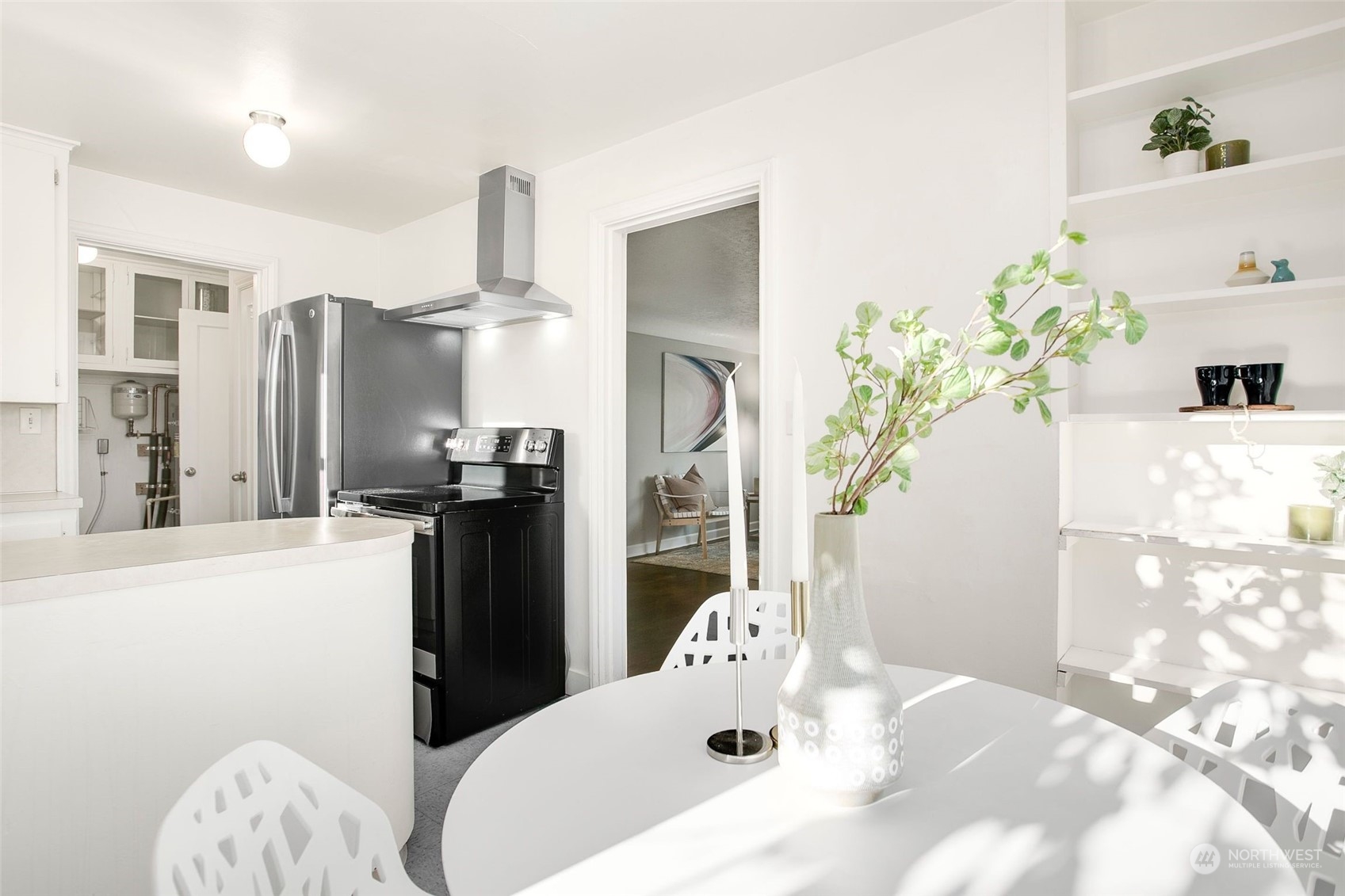 3702 Southwest Holden Street Seattle, WA 98126 - Photo 9 of 23 a kitchen with a refrigerator and a stove