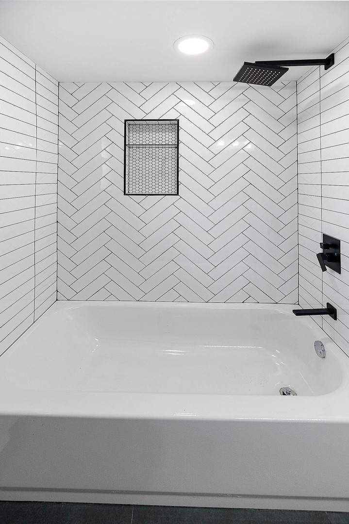 520 Dodson Street Geneva, IL 60134 - Photo 11 of 21 a bathroom with a bathtub and a shower