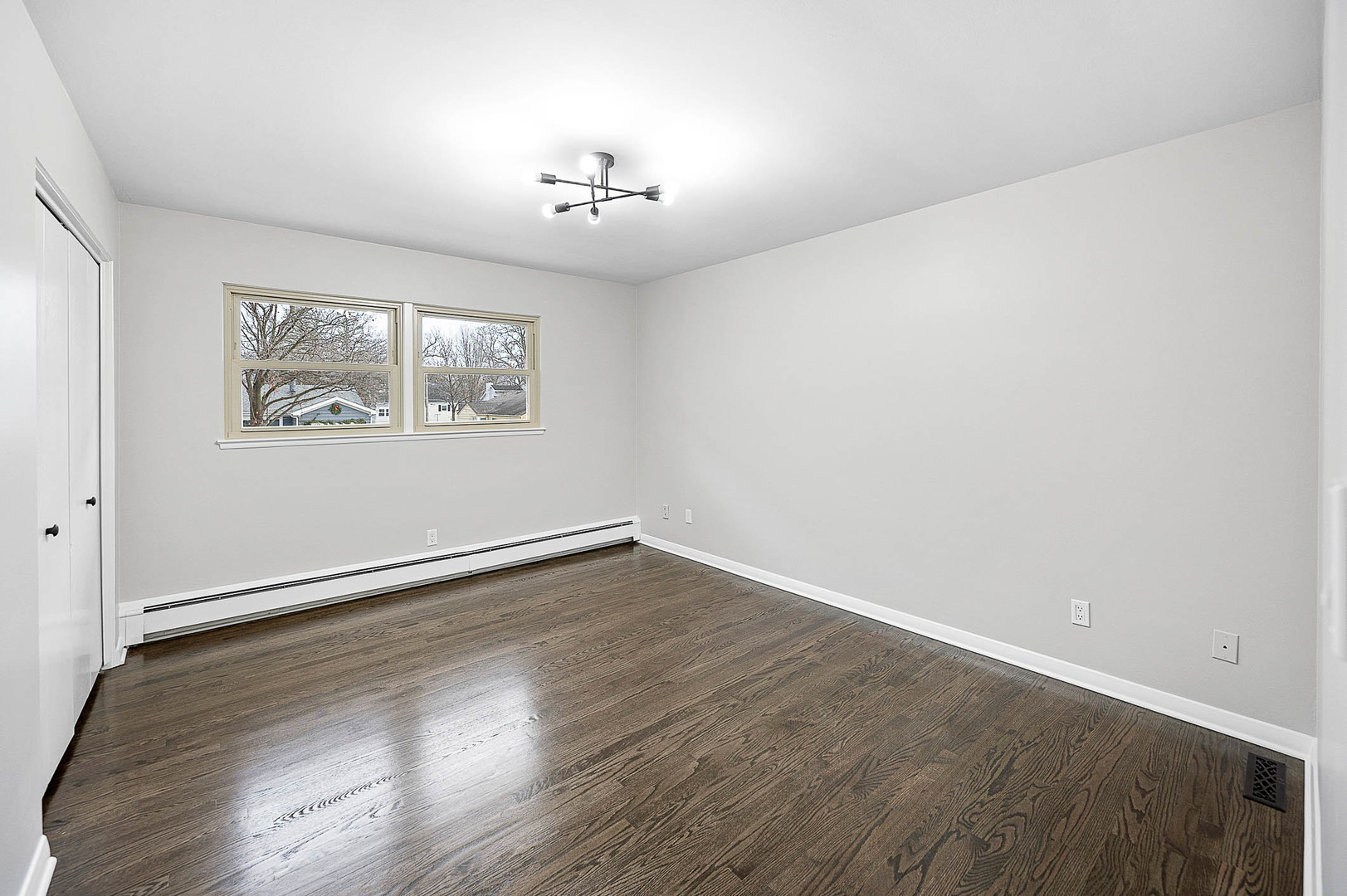 520 Dodson Street Geneva, IL 60134 - Photo 12 of 21 wooden floor in an empty room with a window