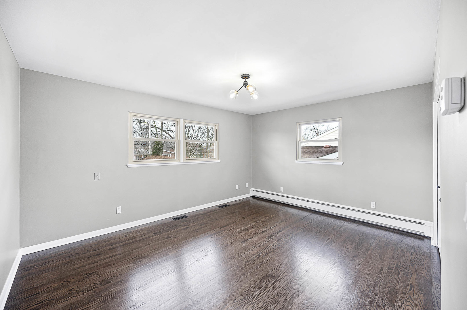 520 Dodson Street Geneva, IL 60134 - Photo 13 of 21 a view of an empty room with wooden floor and a window