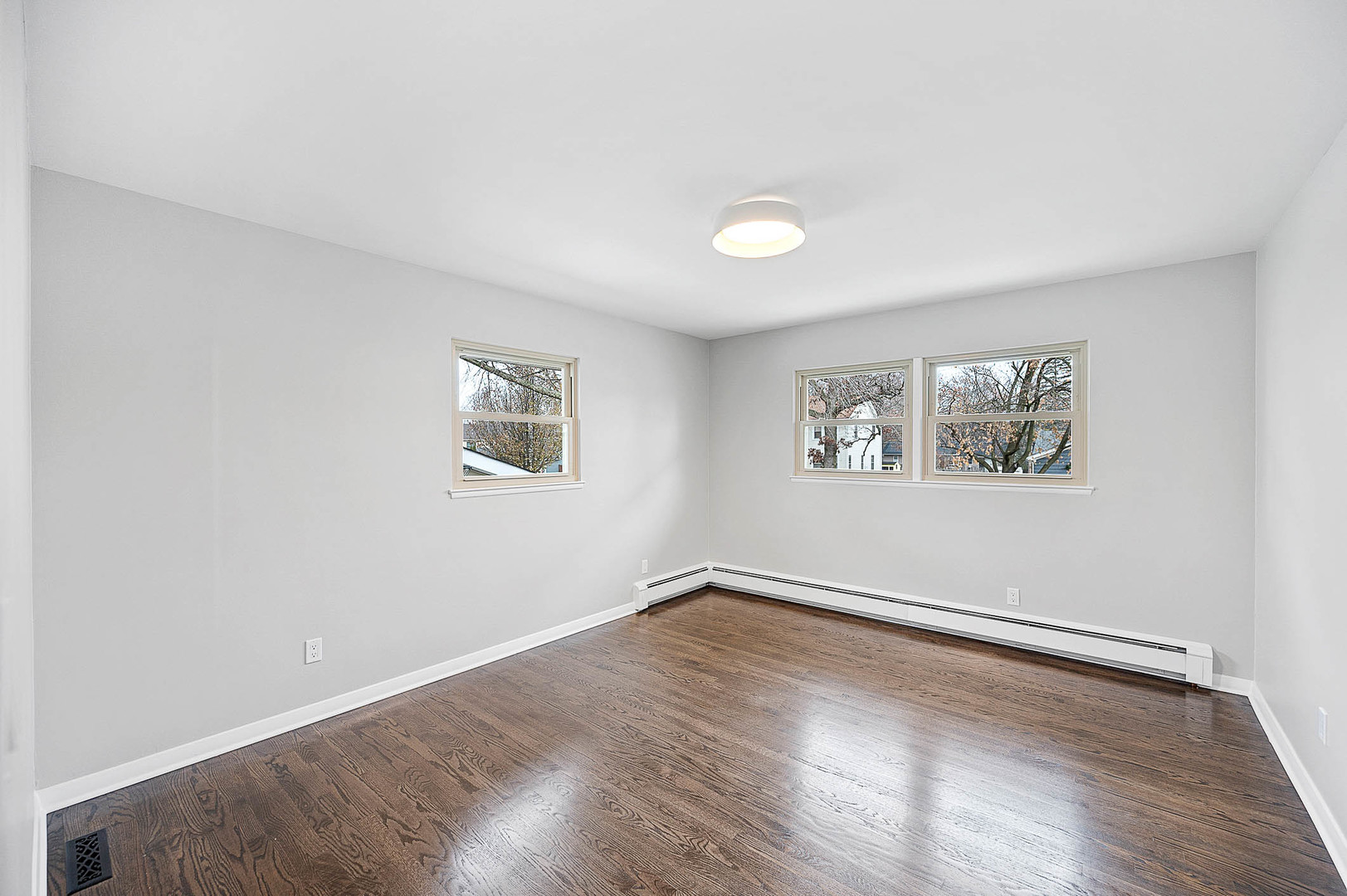 520 Dodson Street Geneva, IL 60134 - Photo 14 of 21 an empty room with wooden floor and windows