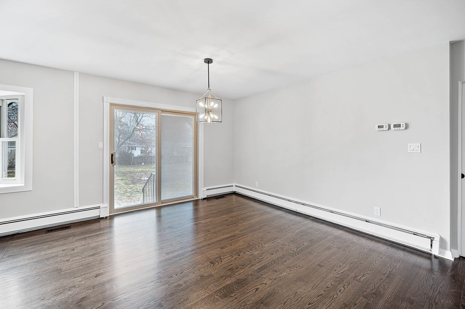 520 Dodson Street Geneva, IL 60134 - Photo 6 of 21 wooden floor in an empty room with a window
