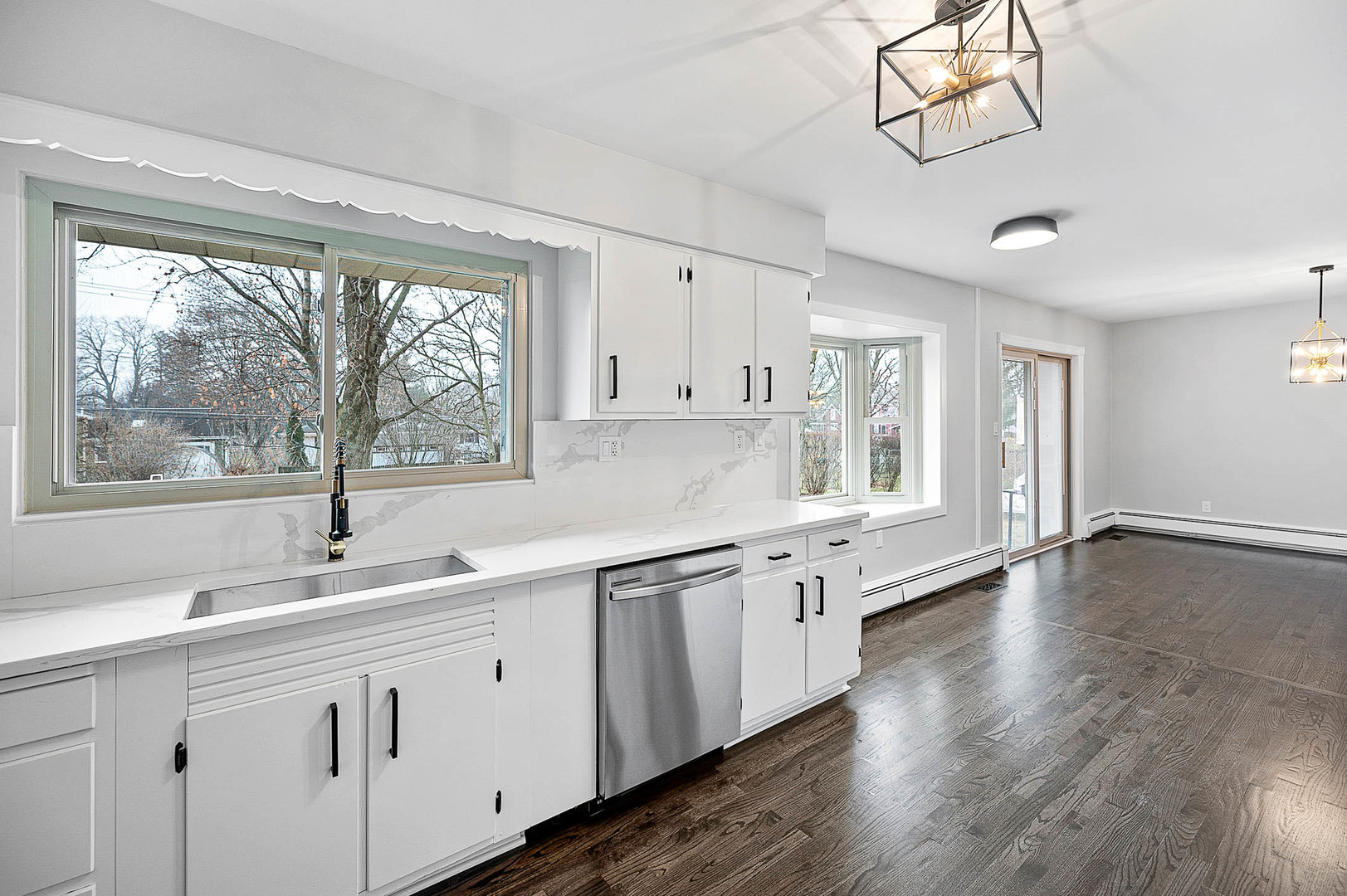 520 Dodson Street Geneva, IL 60134 - Photo 8 of 21 a white kitchen with a large window a sink and appliances