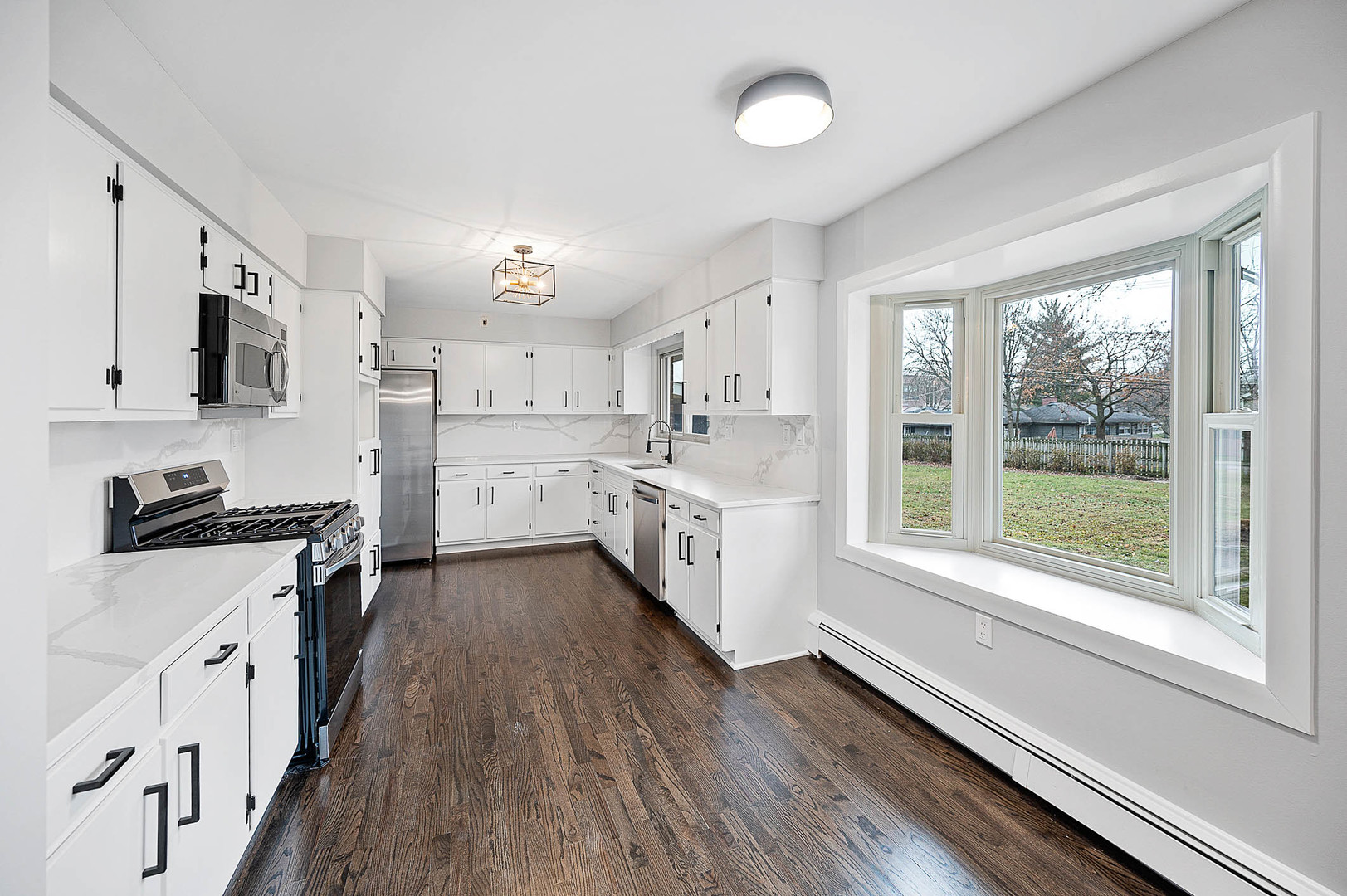 520 Dodson Street Geneva, IL 60134 - Photo 9 of 21 a kitchen with stainless steel appliances a stove top oven
