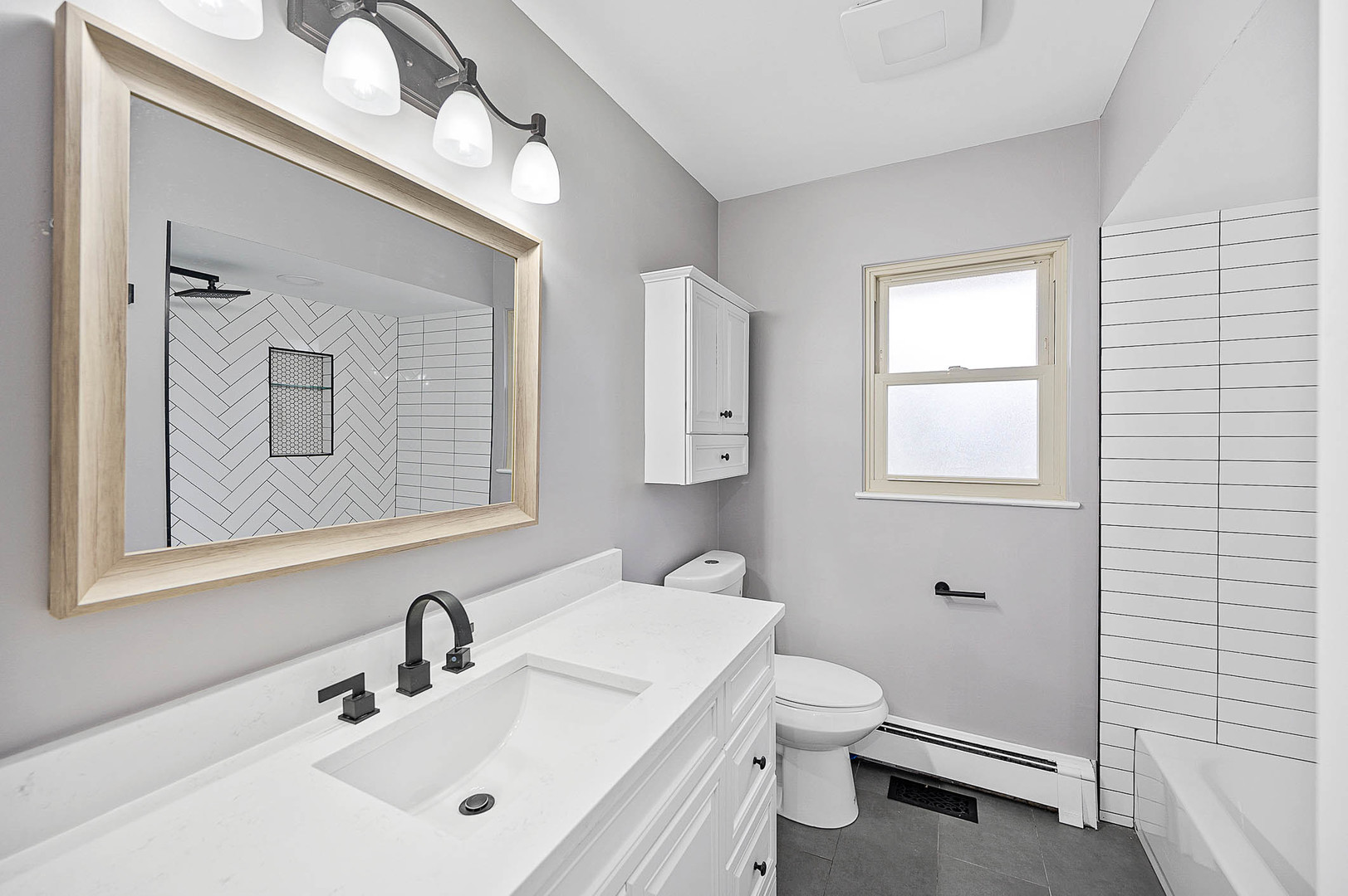 520 Dodson Street Geneva, IL 60134 - Photo 10 of 21 a bathroom with a toilet a sink and mirror