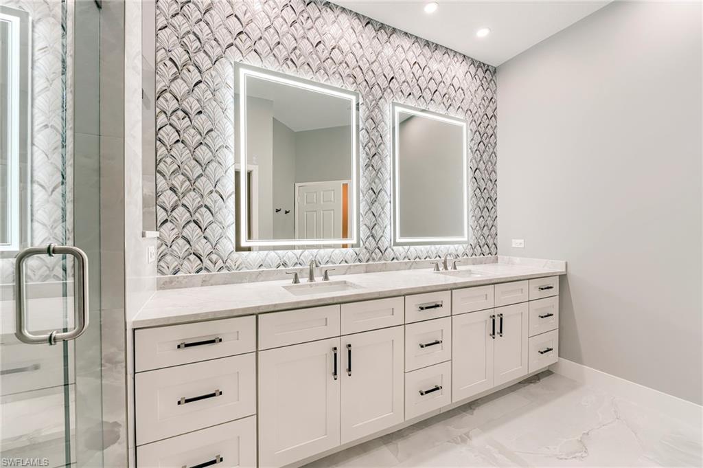 10751 Crooked River Road, Unit 202 Estero, FL 34135 - Photo 13 of 45 10 FOOT QUARTZITE WITH DOUBLE VANITIES